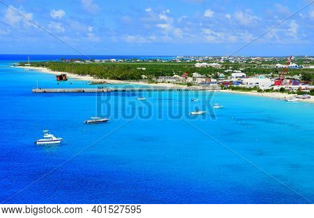 The View Of Beautiful Blue Ocean, Boats And White Sandy Beaches Along The Bay Near Grand Turk, Turks