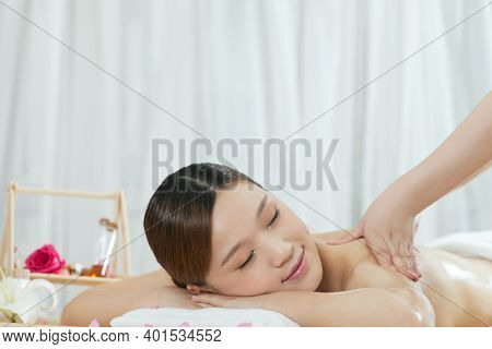 A Young Woman Enjoy Massage High Quality Photo