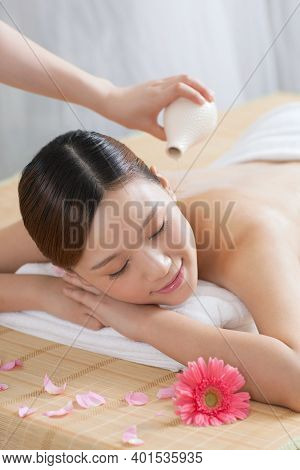 A Young Woman Enjoy Massage High Quality Photo