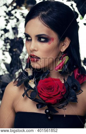 Pretty Brunette Woman With Rose Jewelry, Black And Red, Bright Make Up Kike A Vampire Closeup Red Li