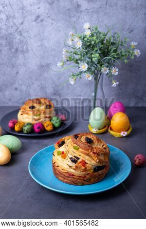 Craffin (cruffin) With Raisins, Nuts And Candied Fruits. Easter Bread Kulich And Painted Eggs. Easte
