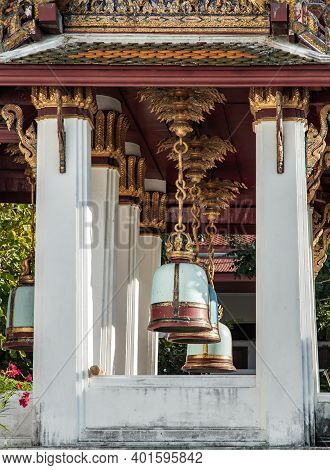 Ancient Bells Hanging On Pillars Outside In The Thai Temple. Thai Temple Bell Which Believe That Who