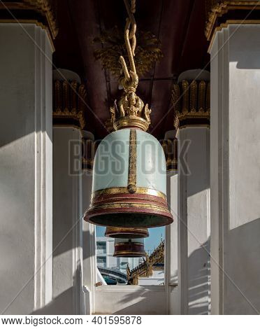 Ancient Bells Hanging On Pillars Outside In The Thai Temple. Thai Temple Bell Which Believe That Who