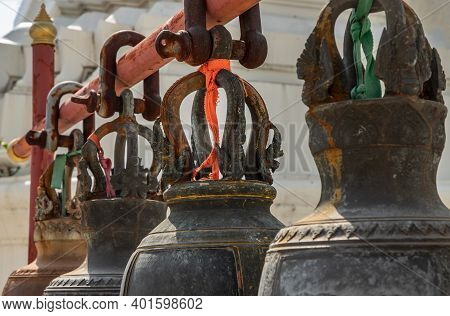 Ancient Bells Hanging On Pillars Outside In The Thai Temple. Thai Temple Bell Which Believe That Who