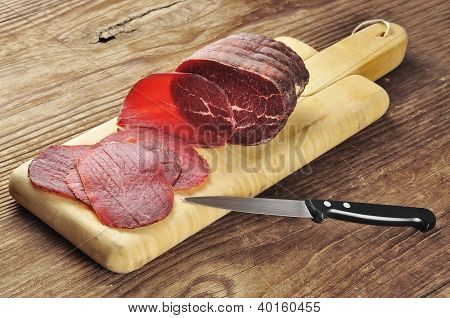 Sliced Bresaola On A Cutting Board