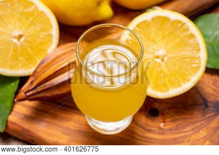 Ice Cold Sweet Limoncello Liqueur Made From New Harvest Of Fresh Ripe Yellow Italian Lemons, Amalfi