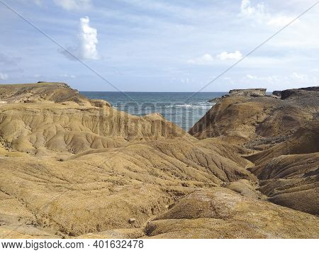 Tropical Landscape Of Volcanic Rock By The Caribbean Sea. Caribbean Desert. Savanna Of Petrification