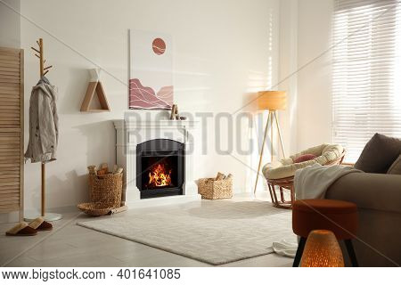 Bright Living Room Interior With Fireplace And Papasan Chair