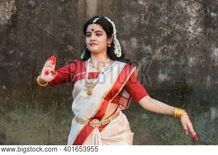 Portrait Of Very Beautiful Indian Girl Dancer Wearing Traditional Indian Saree And Jewellery, In The