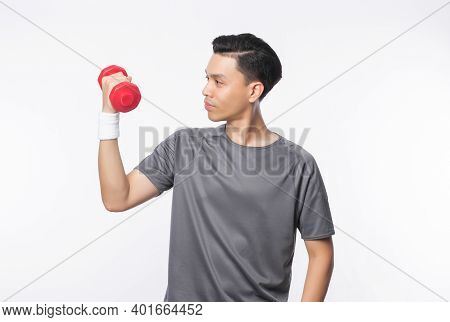 Young Handsome Asian Man In Sport Outfits Exercising With Dumbbell Isolated On White Background.