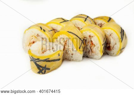 Sushi Roll In Rice Paper With Eel On A White Background, Ingredients Eel, Takuan, Omelette Pancake, 