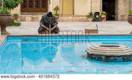 Shiraz, Iran - May 2019: Muslim Man Taking Ablution Before The Upcoming Prayer. It Is A Requirement 