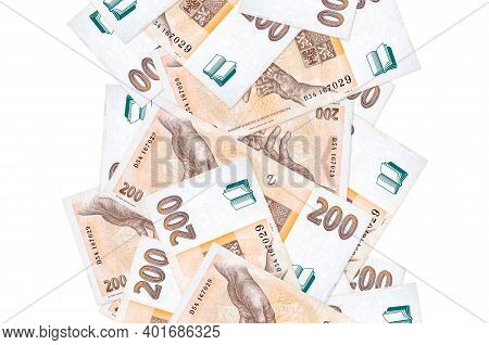 200 Czech Korun Bills Flying Down Isolated On White. Many Banknotes Falling With White Copy Space On