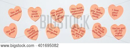 Happy World Or National Compliment Day. Pink Paper Stickers In Heart Shape With Text Of Popular Comp