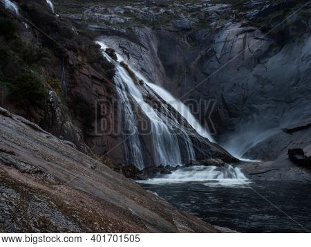 Long Exposure Of Cascada De Ezaro Waterfall Xallas Jallas River Flowing Down Rock In Dumbria La Coru