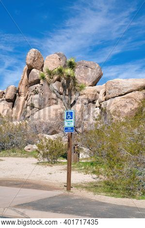 Handicapped Paking Only Sign At Sunny Joshua Tree National Park In California
