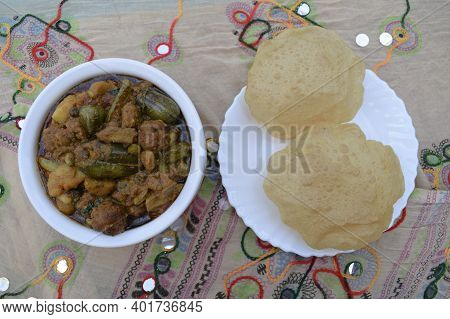 Indian Gujarati Lunch Or Dinner Of Puri And Undhiyu Or Undhiya Curry And Rolled Papad For Festival S