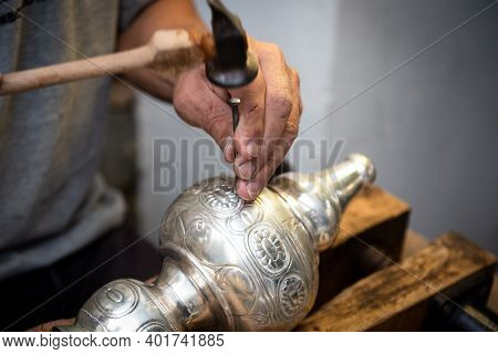 Unrecognized Professional Jewellery Maker Working In Workshop Crafting Silver Vase. Creative People 