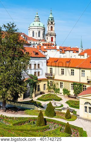 Prague Castle And St Nicholas Church In Lesser Town Of Prague. Sunny Spring Day View From Vrtba Gard