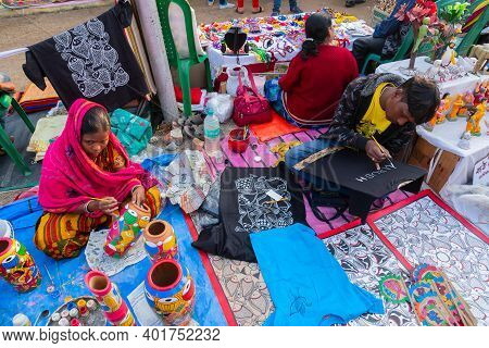 Kolkata, West Bengal, India - 31st December 2018 : Young Bengali Male Artists Painting Pattachitra O