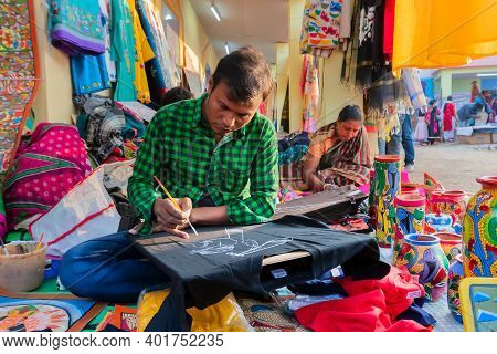 Kolkata, West Bengal, India - 31st December 2018 : Young Bengali Male And Female Artists Painting Pa