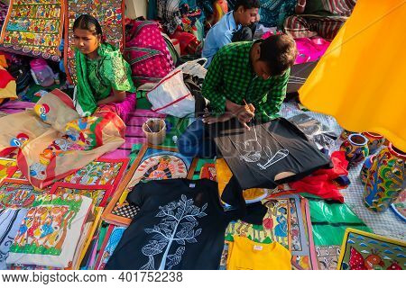 Kolkata, West Bengal, India - 31st December 2018 : Young Bengali Female And Male Artists Painting Pa