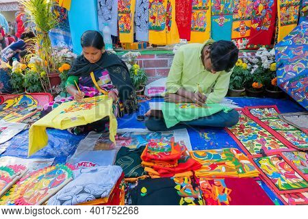 Kolkata, West Bengal, India - 31st December 2018 : Young Bengali Female And Male Artists Painting Pa