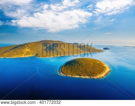 Exotic view of blue lagoon of Ilovik island on sunny day. Location Losinj island, Kvarner Gulf, Croatia, Europe. Aerial photography, drone shot. Luxury vacation concept. Discover the beauty of earth.