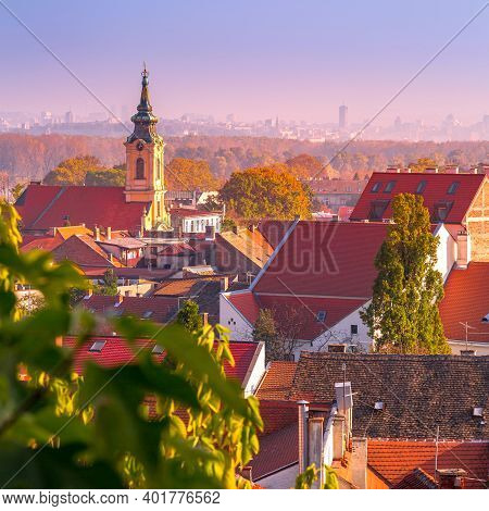 Belgrade, Serbia Panoramic Aerial City View Of Zemun Houses With Church Tower At Sunset