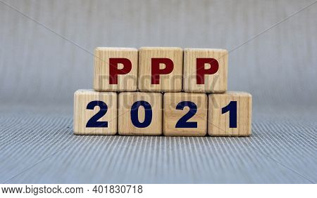 Ppp 2021 - Word On Wooden Cubes On A Gray Background. Business Concept
