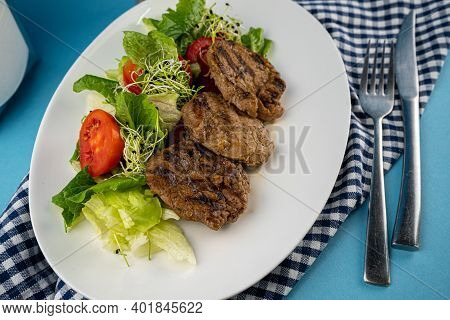 Meat With Vegetables. Pork Medallions. Grilled Meat. Cutlets Close-up. Beef.