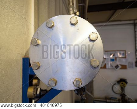Chrome Steel Pipeline End Cap Screwed With Large Screws. Power Plant Gas Station With Control Gauges