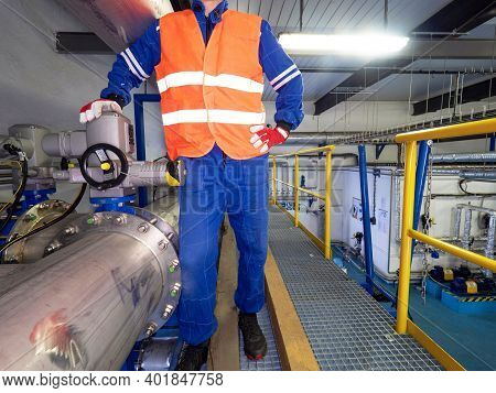 Staff Man Checks The Valves Behind The Compressors Of The High Pressure Biogas Stainless Steel Pipes