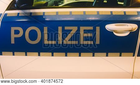 German Police (german: Polizei) Sign In White Letters On A Police Car