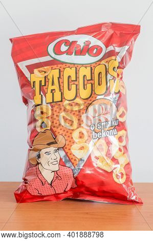Pruszcz Gdanski, Poland - September 29, 2020: Chio Taccos Chips Bacon Flavor On Wooden Table.