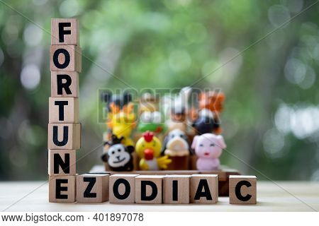 Wood Text Of Fortune Zodiac With Cute Doll Of China Zodiac Background. Concept Of Fortune