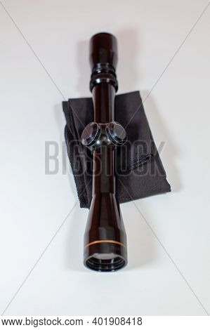 A Compact, 3x9 Magnification Scope Sits On A White Background, Ready To Be Mounted On A Rifle To Hel