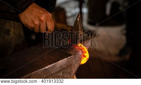 Detail Shot Of Metal Being Worked At A Blacksmith Forge, Blacksmith Working On Metal On Anvil At For