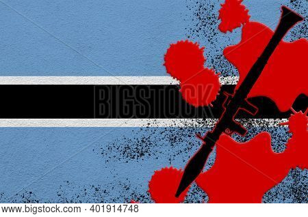 Botswana Flag And Black Rpg-7 Rocket-propelled Grenade Launcher In Red Blood. Concept For Terror Att
