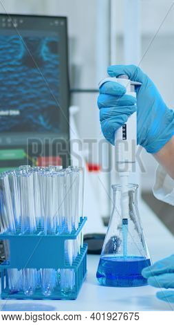 Close Up Of Researcher Testing Liquid Sample Using Micropipette For New Treatment Medical Laboratory