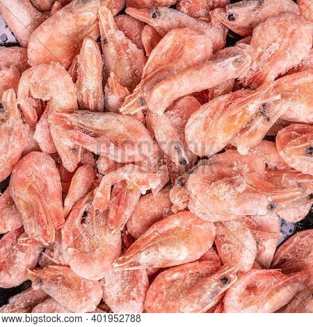 Frozen Shrimp. Raw Shrimp Background. Pile Of Frozen Shrimps On White Background. Close-up Of Frozen