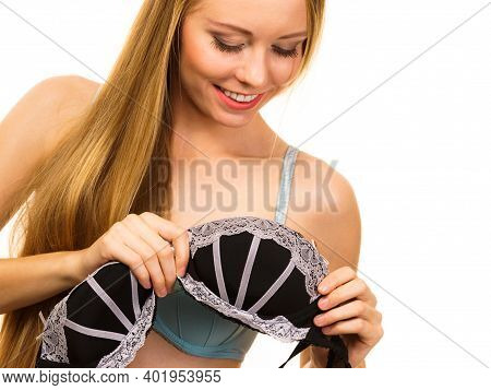 Blonde Woman Trying On Black Bra With White Lace. Girl Removed Underwires From Cups. Bosom Concept.