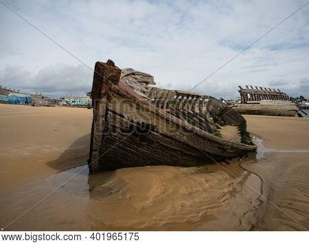 Stranded Broken Wooden Shipwrecks On Fishing Boat Naval Graveyard Marine Cemetery In Magouer Etel Ri