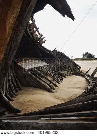 Stranded Broken Wooden Shipwrecks On Fishing Boat Naval Graveyard Marine Cemetery In Magouer Etel Ri