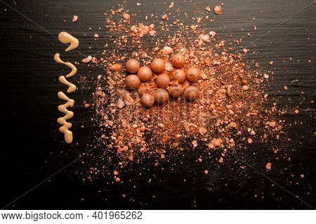 Brushes For Makeup On A Black Background With Beige Powder. Brown Face Powder And Makeup Brushes On 