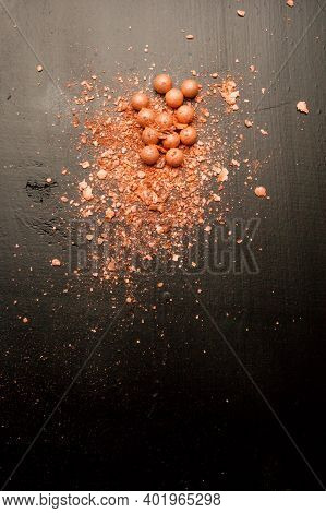 Brushes For Makeup On A Black Background With Beige Powder. Brown Face Powder And Makeup Brushes On 