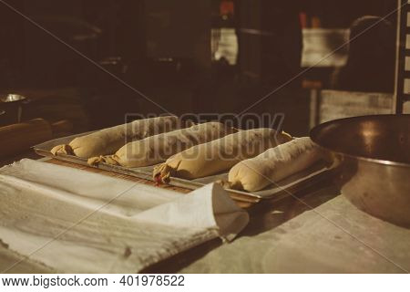 Ingredients For Baking Strudel Stuffed With Canned Cherries. The Cook Is Preparing A Cherry Strudel.