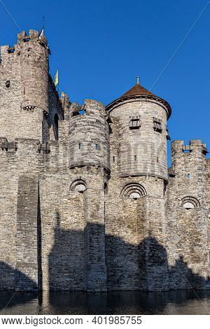 Castle Of Ghent (gand) Mirroring In The Water (belgium)