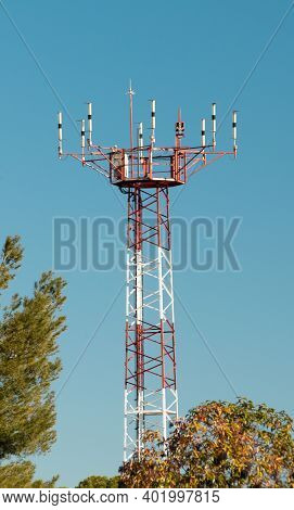 Telecommunication Tower. Cellular Mobile Radio Transmission Pole Tower On The Blue Sky