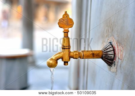 Antique Turkish faucet on wall